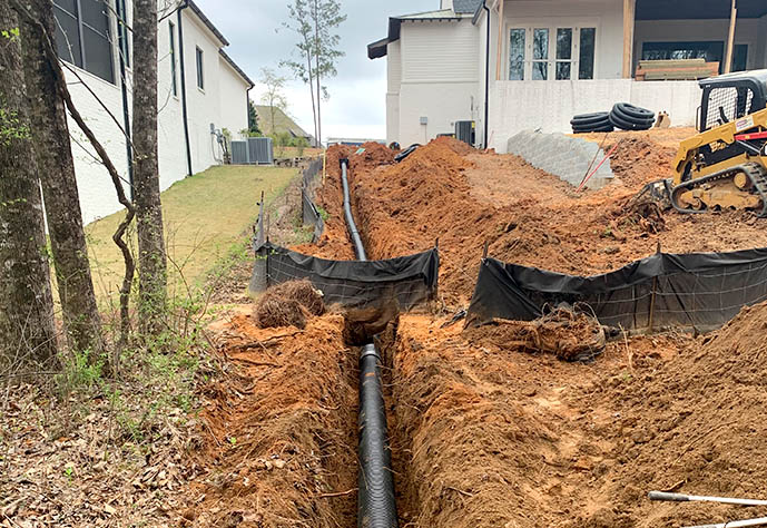 Edmonds Environmental fixing a huge drainage problem Tuscaloosa Albamba