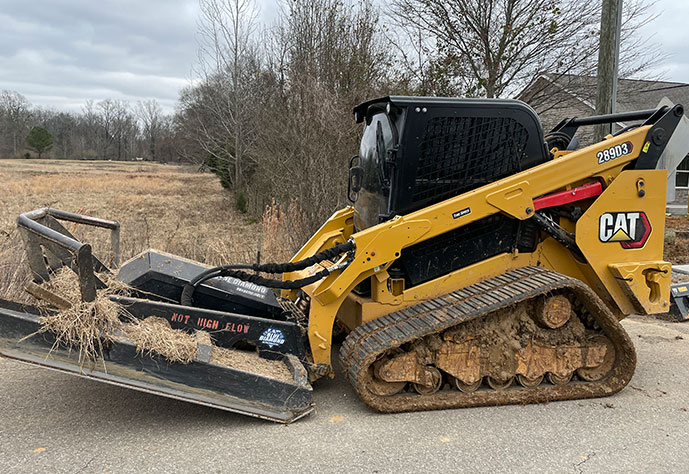 Edmonds Environmental Bobcat spreading dirt