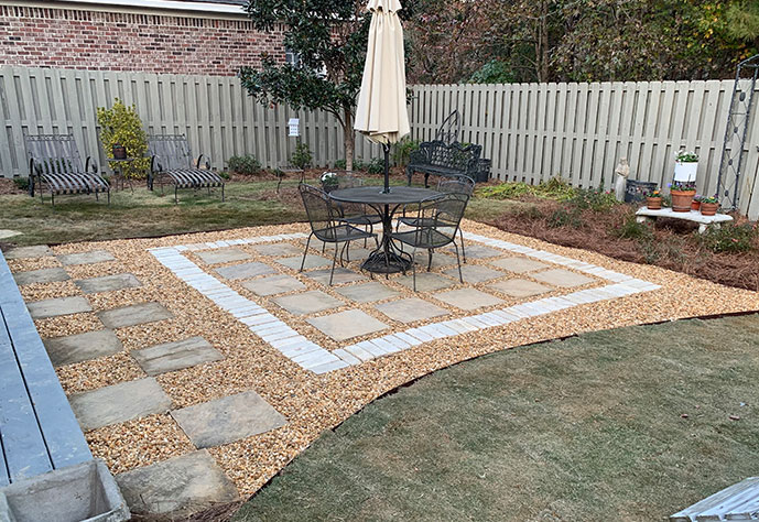 Outdoor living space stone patio designed and installed by Edmonds Environmental